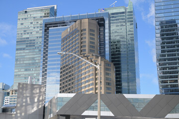 Naklejka premium pedestrian foot bridge and buildings incl Intercontinental hotel and other business and residential towers, viewed from Lower Simcoe St and Bremner Blvd, Toronto
