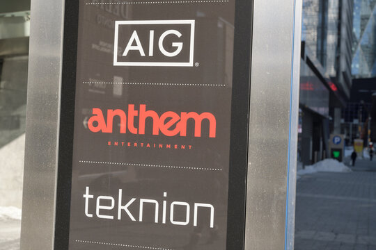 pylon street sign outside Southcore Financial Centre incl logo signs of AIG, anthem entertainment, and teknion at 120 Bremner Blvd, Toronto