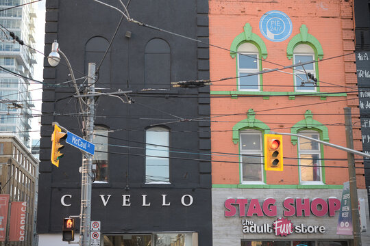 exterior building facade and sign of Civello and Stag Shop at 269 and 271 Queen St W, Toronto