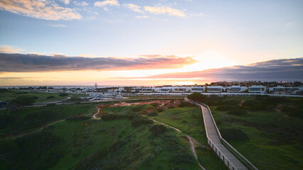 Aerial Sunset View Over Coastal Resort and Atlantic Ocean in Lagos, Algarve, Portugal