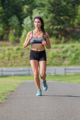 Female Athlete Works Out Outdoors, Embracing Strength, Focus, and Natural Energy