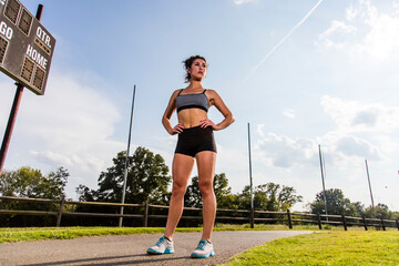Female Athlete Works Out Outdoors, Embracing Strength, Focus, and Natural Energy