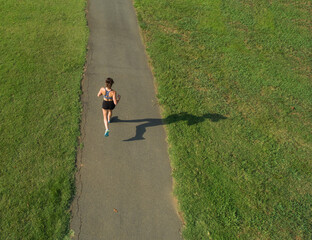 Female Athlete Works Out Outdoors, Embracing Strength, Focus, and Natural Energy
