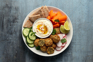Falafel Plate Platter with hummus, vegetables and pita. Healthy food snack.