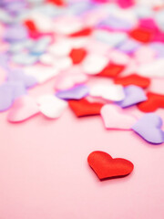 Fototapeta premium Beautiful and festive background for valentines day, birthday or anniversary celebration with hearts in red and pink with cop space for text
