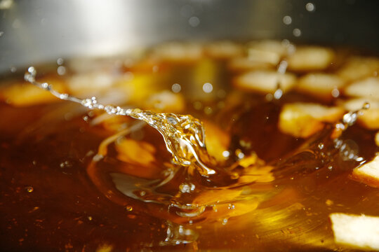 Frying stale bread in hot cooking oil