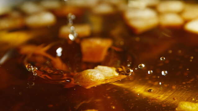 Frying stale bread in hot cooking oil