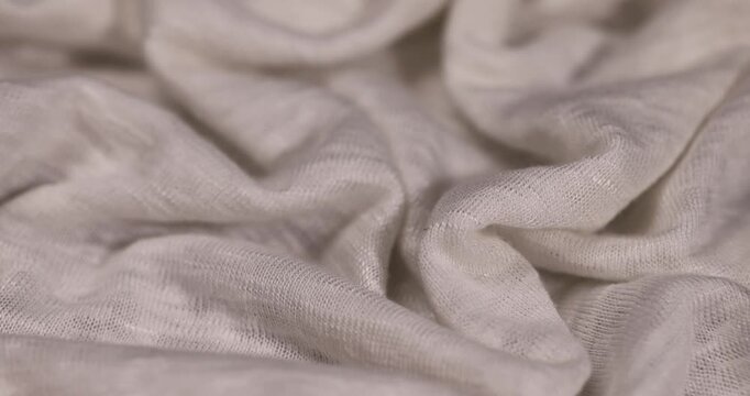 natural fabric with tightly intertwined threads for making garments, wide light-colored fabric for sewing sweatshirts, T-shirts and other clothing