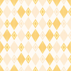 Circus carnival yellow and beige vintage seamless pattern. Soft harlequin rhombus background. Wrapping texture backdrop with diamond shape pattern. 