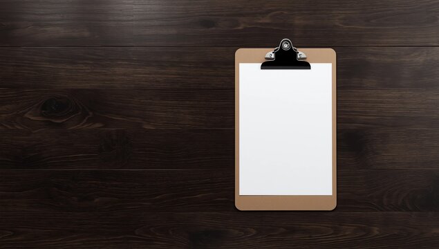 Clipboard with empty sheet of paper on wooden table