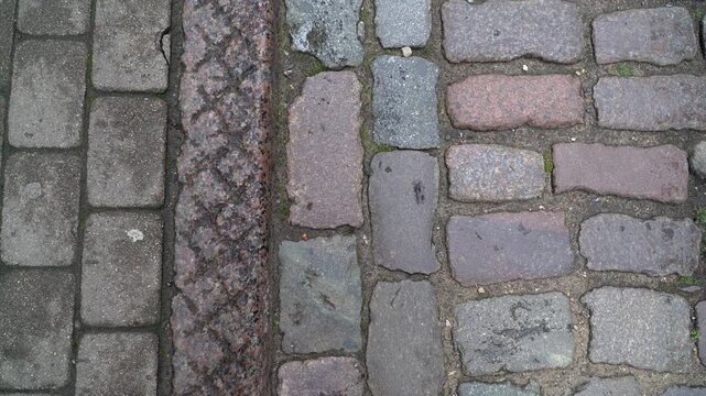 A vintage cobblestone paved street, top view.
