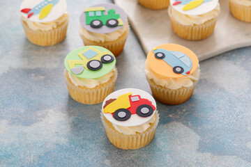 Cupcakes for a boy birthday or a baby shower with trucks and transport theme