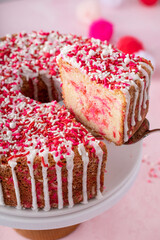 Pound cake baked in a Bundt pan with pink sprinkles for Valentines Day