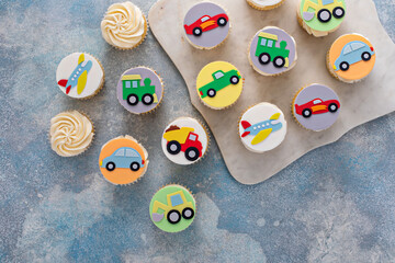 Cupcakes for a boy birthday or a baby shower with trucks and transport theme