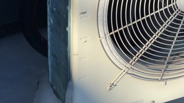 Thick Ice Accumulation on Heat Pump Stand Legs. A close-up shows metal heat pump stand legs encased in thick clear ice, highlighting the severity of freezing conditions for HVAC.