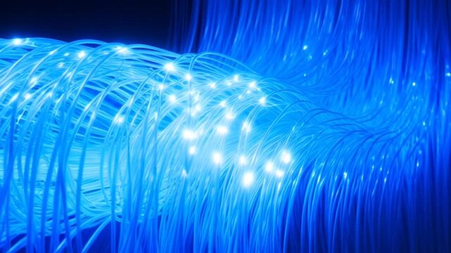 A video showcasing a bundle of illuminated fiber optic cables in a dark environment