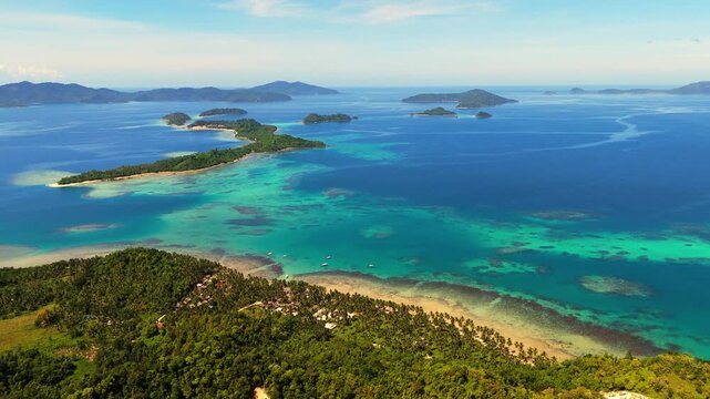 aerial drone shot of Cagsalay Island in Port Barton, San Vicente, Palawan. Features pristine white sand beaches and crystal-clear turquoise waters in a tropical paradise