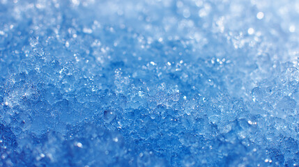 Obraz premium A close-up photograph capturing the textured details of fresh, glistening ice crystals. It showcases a stunning display of icy formations and subtle hues of blue