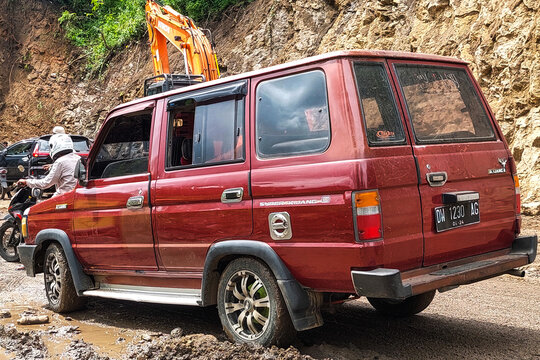 Maros Camba, Indonesia - 08 June 2024 : Kijang car parked on the side of the road