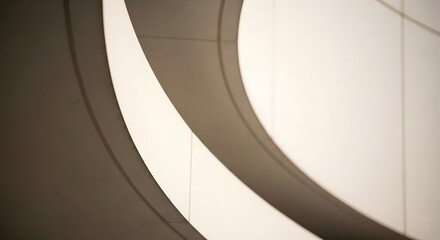 Obraz premium Captivating interplay of light and shadow on gracefully curved architectural forms, creating a minimalist and abstract composition with striking modern design elements