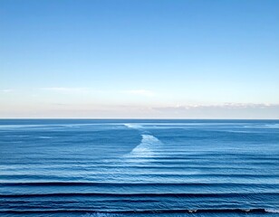 Expansive view Ocean waves rolling under a serene, cloudless sky