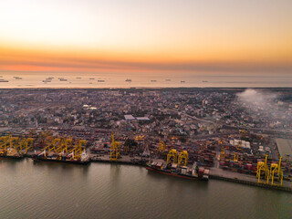 Naklejka premium High-Angle Perspective of Container Shipping Hub in Chattogram, Bangladesh. Busy Container Terminal and Cargo Ships at Chattogram Sea Port, Bangladesh. 