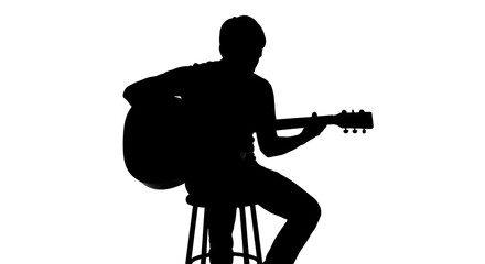 Man sitting on stool playing acoustic guitar against a white background with dramatic lighting creating a silhouette effect