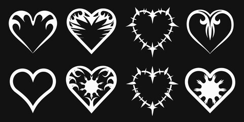 Collection of ornate white hearts with varied designs on a black background