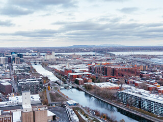 Obraz premium defaultAerial view of Griffintown Montreal and Lachine Canal with winter cityscape and river at daytime. g.