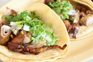Authentic tacos de buche with coriander, onion and lime. Ready to eat. 