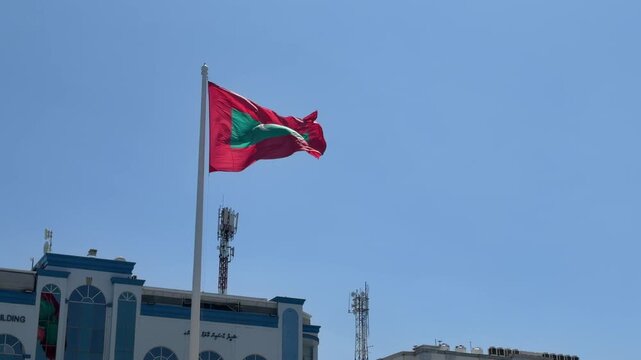 Maldives big flag blowing in the wind in male Mal&eacute; capital city