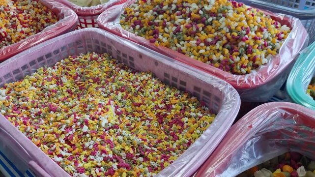 Different types of colorful fusilli pasta made from organic raw ingredients on display at the floating market in Can Tho, Vietnam, showcasing vegan food, shapes, and vibrant natural colors, Vietnam