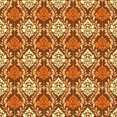 Elegant seamless damask pattern with classic floral ornaments in brown, cream and orange tones. Vintage luxury background suitable for wallpaper, textile, fabric, wrapping paper and interior design.
