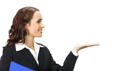 Profile portrait image - smiling businesswoman woman hold blue folder wear black jacket, point, show, demonstrate some product, free text space. Business ad concept. Isolated against white background © vgstudio