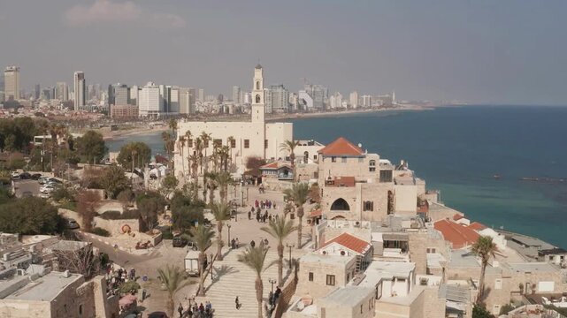Historic Skyline of Old Jaffa with Saint Peter's Church and Ottoman Clock Tower at Sunset