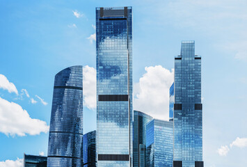 Obraz premium View of modern buildings in Moscow City with blue sky and clouds in the background