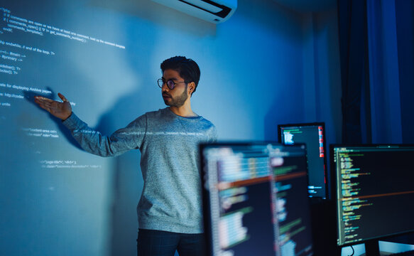 Programmer giving a Presentation using a Projector to show Code for Software Development and Technology Innovation with Artificial Intelligence
