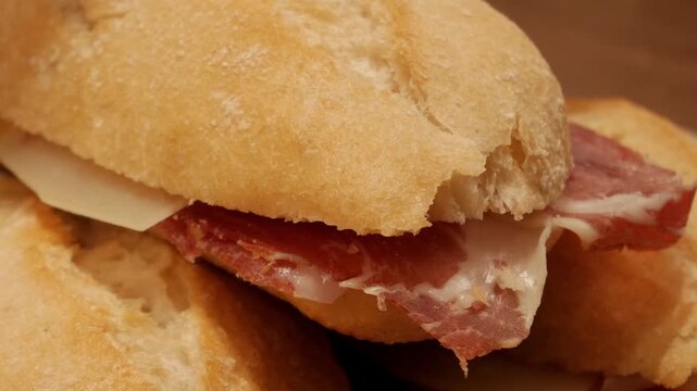 Delicious bocadillo with jamon iberico and cheese on fresh bread