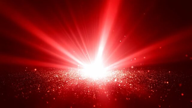 Bright Red Explosion of Light and Glittering Particles Across Dark Background