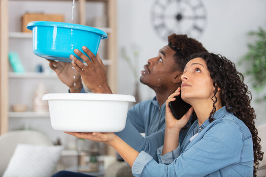 couple having leaking problems at home
