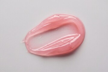 Translucent light rose pink cosmetic gel in viscous smudge sample