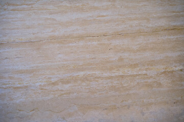 Fototapeta premium Travertine stone surface showing natural beige texture and pattern