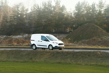 White utility van on scenic countryside