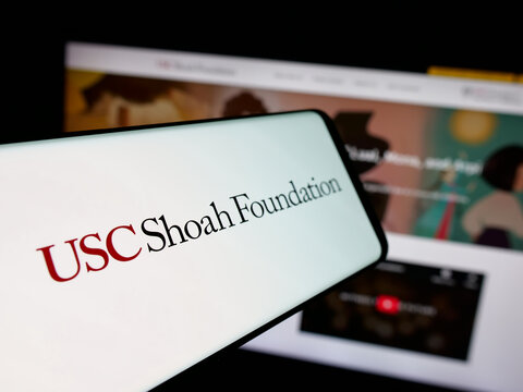 Stuttgart, Germany - 01-30-2026: Smartphone with logo of US organisation USC Shoah Foundation on screen in front of website. Focus on center-left of phone display.