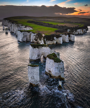Studland, Dorset, UK - Aerial vertical view of Old Harry Rocks white cliffs at sunset with dramatic sky. Jurassic coast, Unesco world heritage site, Swanage, Dorset, England, United Kingdom, Europe