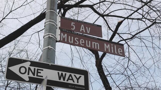 5th avenue museum mile sign on street signpost (light pole) in manhattan new york city upper east side (travel tourism art museums)
