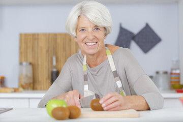 woman preparing salad in the kitchen