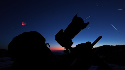 Fototapeta premium Amateur astronomer observing stars, planets, Moon eclipse and other celestial objects.