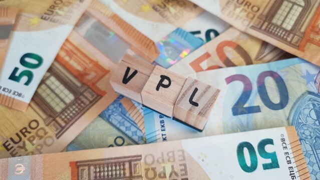 VPL acronym made of wooden letter cubes on pile of Euro banknotes. Vervroegde Pensioenlasten (Early Pension Costs)