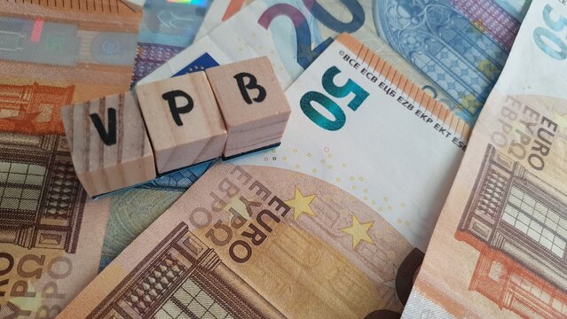 VPB acronym made of wooden letter cubes on pile of Euro banknotes. Vennootschapsbelasting (Corporate Tax)